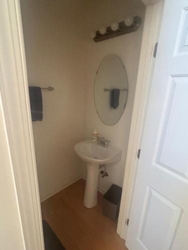 a bathroom with a sink and a mirror at Dayton Gem in Dayton