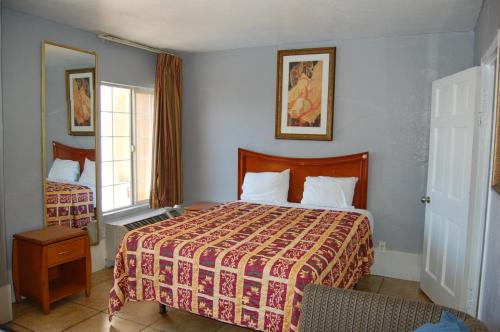 Postel nebo postele na pokoji v ubytování Parklane Motel