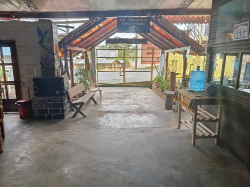 an empty room with a brick wall and a building at El Colibrí in Puyo