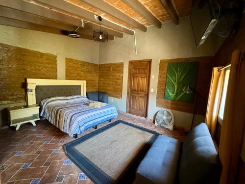 Ένα ή περισσότερα κρεβάτια σε δωμάτιο στο Cabañita TEPOZTLÁN