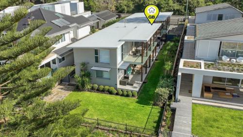 an aerial view of a house with a speed sign at Ocean Sunrise - Magical in Avoca Beach