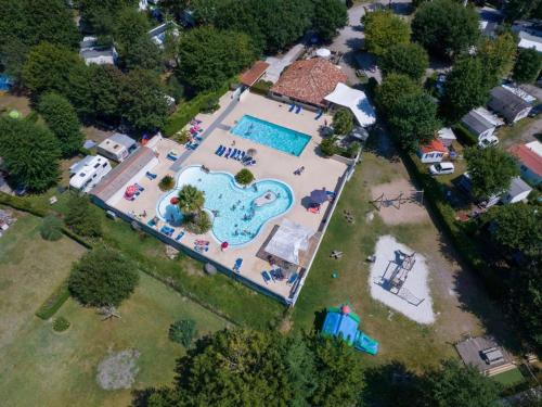 an aerial view of a swimming pool in a park at Mobil-home pour 6 personnes avec terrasse - API-1-52-655 in Sainte-Eulalie-en-Born