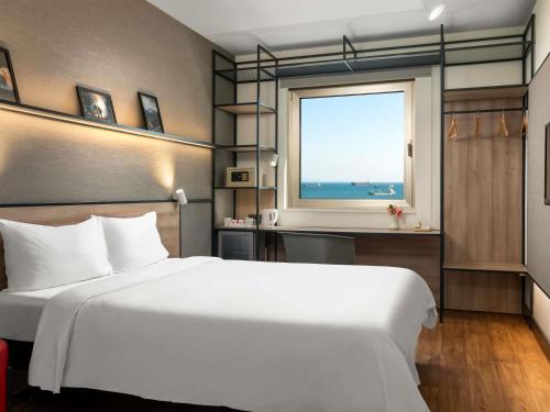 Ένα ή περισσότερα κρεβάτια σε δωμάτιο στο Ibis Istanbul Zeytinburnu