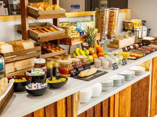 a buffet filled with lots of different types of food at ibis budget Sheffield Arena in Sheffield