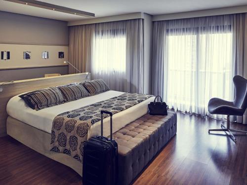 Un pat sau paturi într-o cameră la Mercure Sao Paulo Pamplona