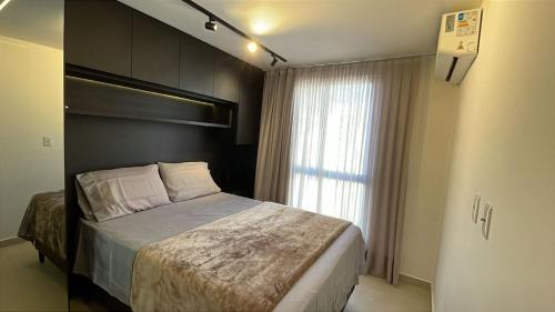 Postel nebo postele na pokoji v ubytování TS402-Apê lindo e aconchegante p/ 4 pessoas na praia