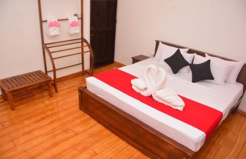 Postel nebo postele na pokoji v ubytování Art Villa Homestay