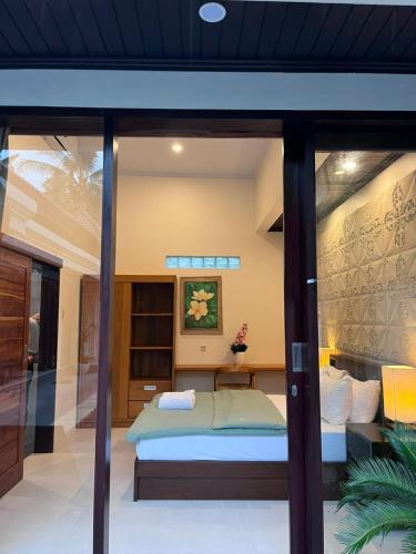 a bedroom with a bed in a room at Pranajaya paradise in Tejakula