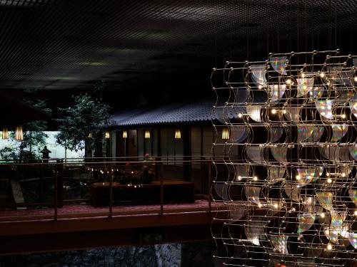 a christmas tree with lights on a building at Hamanoyu in Suwa