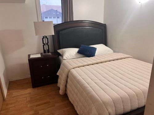 a bedroom with a bed with a blue pillow on it at Gull lake in Winnipeg