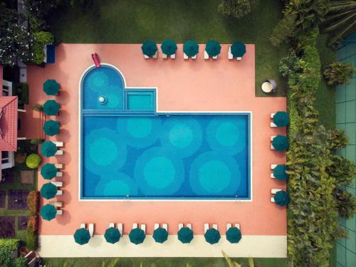 an overhead view of a swimming pool in a house at Sofitel Phnom Penh Phokeethra in Phnom Penh