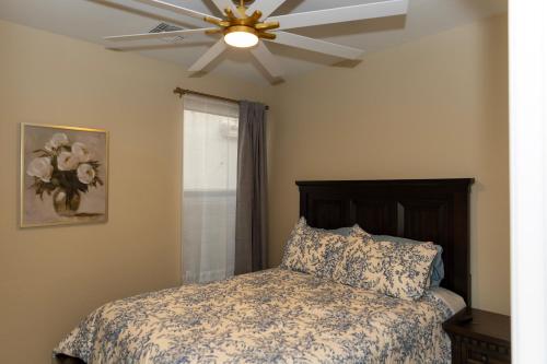 a bedroom with a bed with a ceiling fan at The Margarita in Phoenix