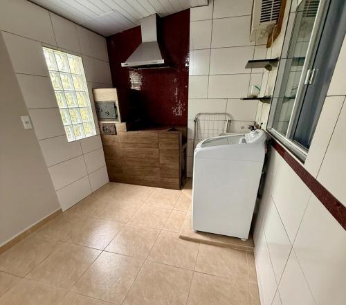 Køkken eller tekøkken på Casa charmosa praia Itapema