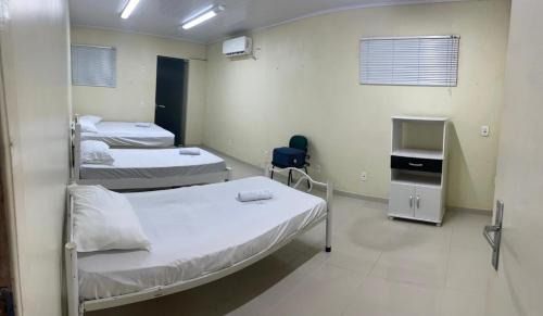 Ένα ή περισσότερα κρεβάτια σε δωμάτιο στο Los Hermanos