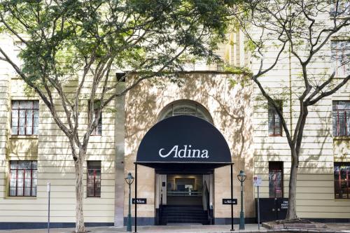 aania sign on the front of a building at Adina Apartment Hotel Brisbane Anzac Square in Brisbane