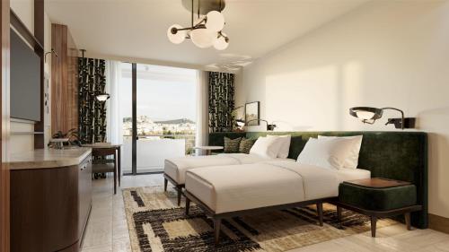 a hotel room with a bed and a kitchen at Conrad Athens The Ilisian in Athens