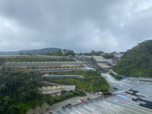 an aerial view of a city with buildings and trees at Jo’s Place Cameron Highlands EA922 in Brinchang