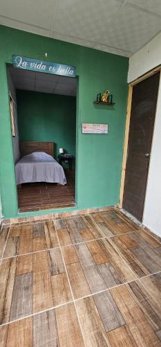 Ένα ή περισσότερα κρεβάτια σε δωμάτιο στο Habitación privada en Boquete