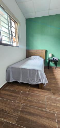 Ένα ή περισσότερα κρεβάτια σε δωμάτιο στο Habitación privada en Boquete