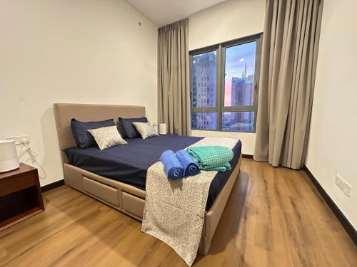 a bedroom with a bed and a large window at Colombo Stay - Skyview Retreat in Colombo