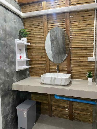 a bathroom with a sink and a mirror at Lanta Wild Beach Resort in Ko Lanta