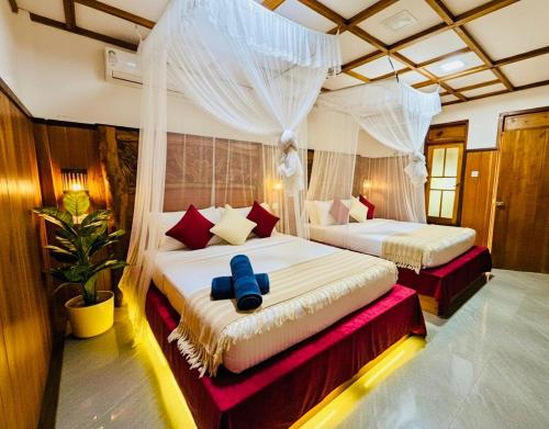 Postel nebo postele na pokoji v ubytování Udawalawa Safari House