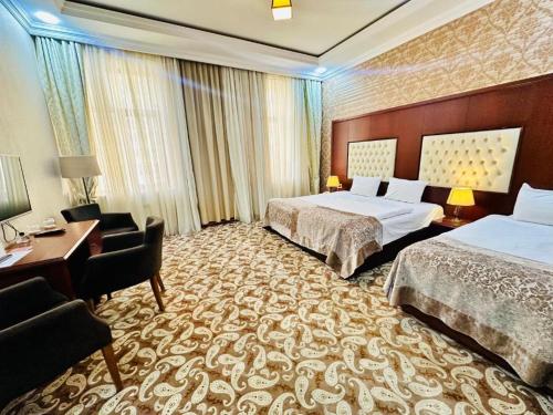 Ένα ή περισσότερα κρεβάτια σε δωμάτιο στο Clover Hotel