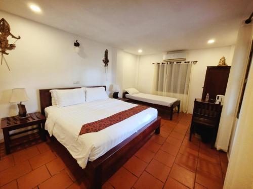 Postel nebo postele na pokoji v ubytování Paradise K Forest Hotel