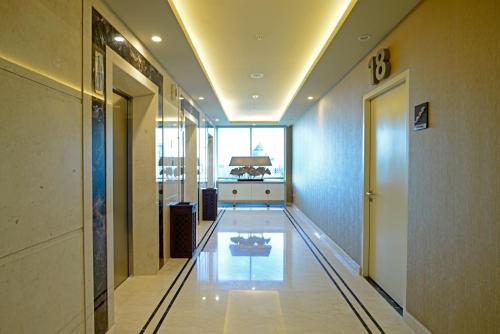 a hallway of a building with a bowling alley at Aria Centra Surabaya in Surabaya