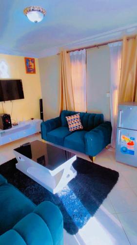 TV a/nebo společenská místnost v ubytování Ash homes