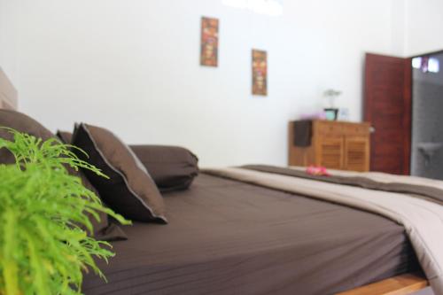 Postel nebo postele na pokoji v ubytování Umah Dauh Homestay