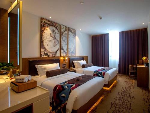 Ένα ή περισσότερα κρεβάτια σε δωμάτιο στο James Joyce Coffetel· Wuhan Wangjiawan Taojialing Metro Station