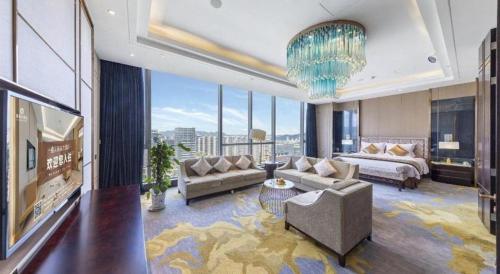 a large living room with a view of a city at Xincheng hotel in Zunyi