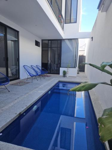 a swimming pool in the middle of a house at Casa Privada Acapulco in Acapulco