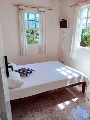 Postel nebo postele na pokoji v ubytování Code In Hospedaria