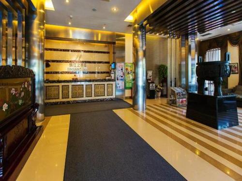 a bowling alley with a game console in a building at Jinjiang Inn Daqing Xincun Development Zone in Daqing