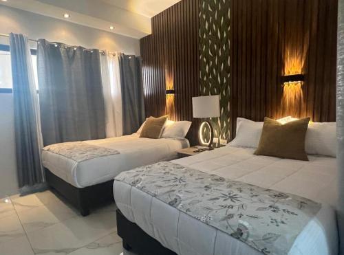 Postel nebo postele na pokoji v ubytování DEPARTAMENTO CON TERRAZA Y VISTA para 6 personas