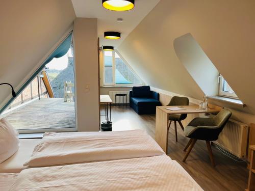 Postel nebo postele na pokoji v ubytování Hotel Alte Fischerkate