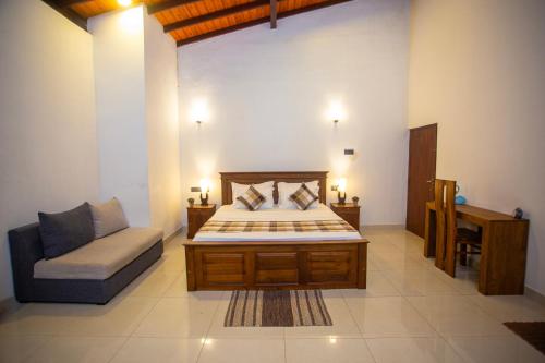 Ένα ή περισσότερα κρεβάτια σε δωμάτιο στο The Moonz Villa