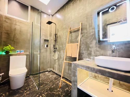 a bathroom with a sink and a shower at Hello Mirissa in Mirissa