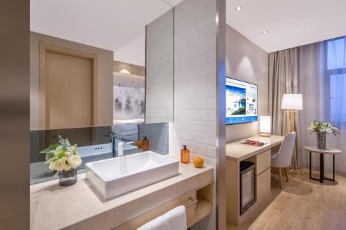 Μια τηλεόραση ή/και κέντρο ψυχαγωγίας στο Orange Hotel Beijing Jiugong