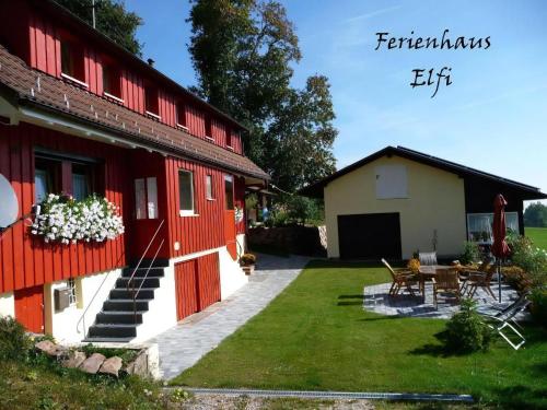a house with a garden and a patio at Ferienhaus Elfi in Oberbränd