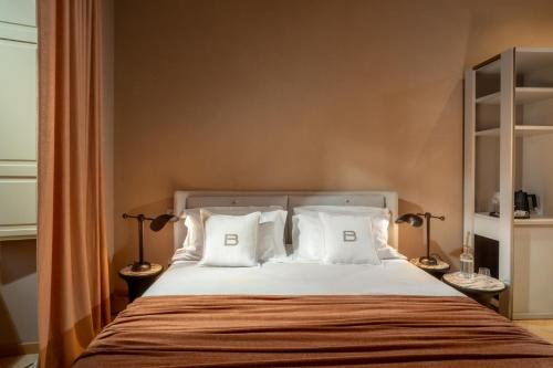 Letto o letti in una camera di Palazzo Balsamo Boutique Hotel