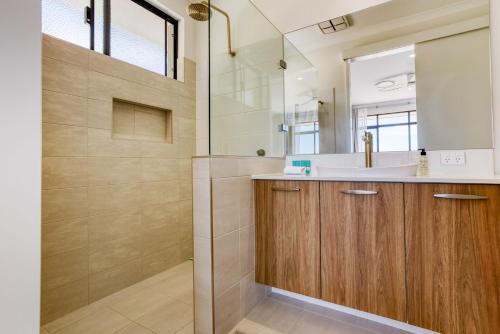 a bathroom with a sink and a shower at Casa Al Mare in Busselton