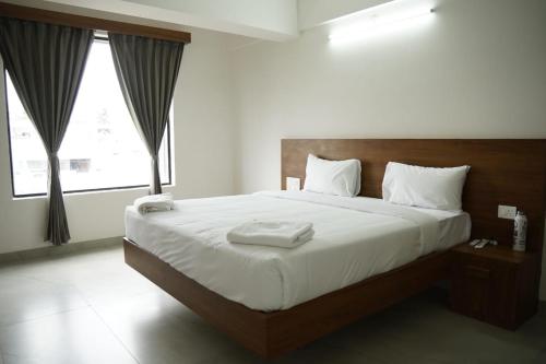 Ένα ή περισσότερα κρεβάτια σε δωμάτιο στο KK Service Suites