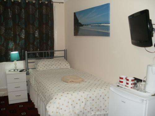 Postel nebo postele na pokoji v ubytování London Heathrow Guesthouse