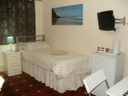 Postel nebo postele na pokoji v ubytování London Heathrow Guesthouse