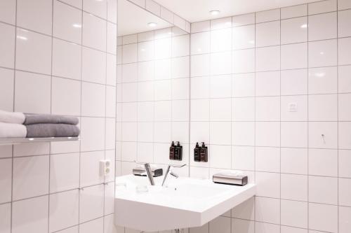 Phòng tắm tại Home Hotel Helma