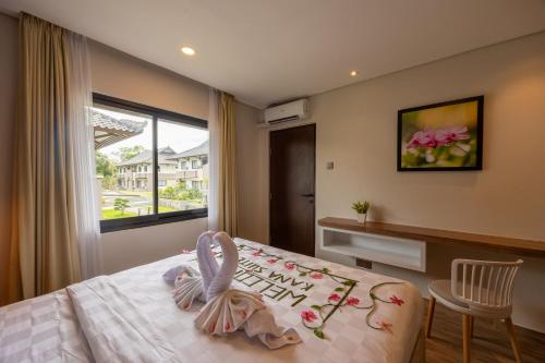 Postel nebo postele na pokoji v ubytování Kana Suites Jimbaran By Fays Hospitality