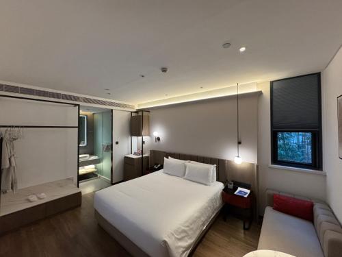 Voodi või voodid majutusasutuse W9-Hotel ShangHai PuDong Airport toas